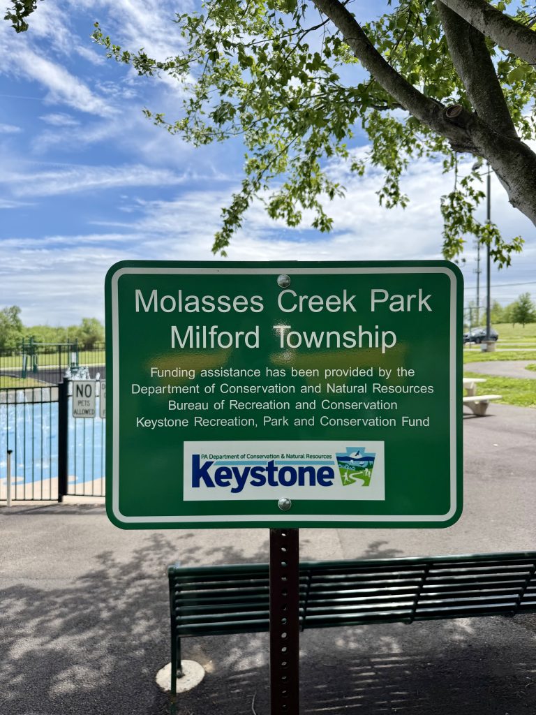 Image showing sign of how the splash pad was funding through a grant.
